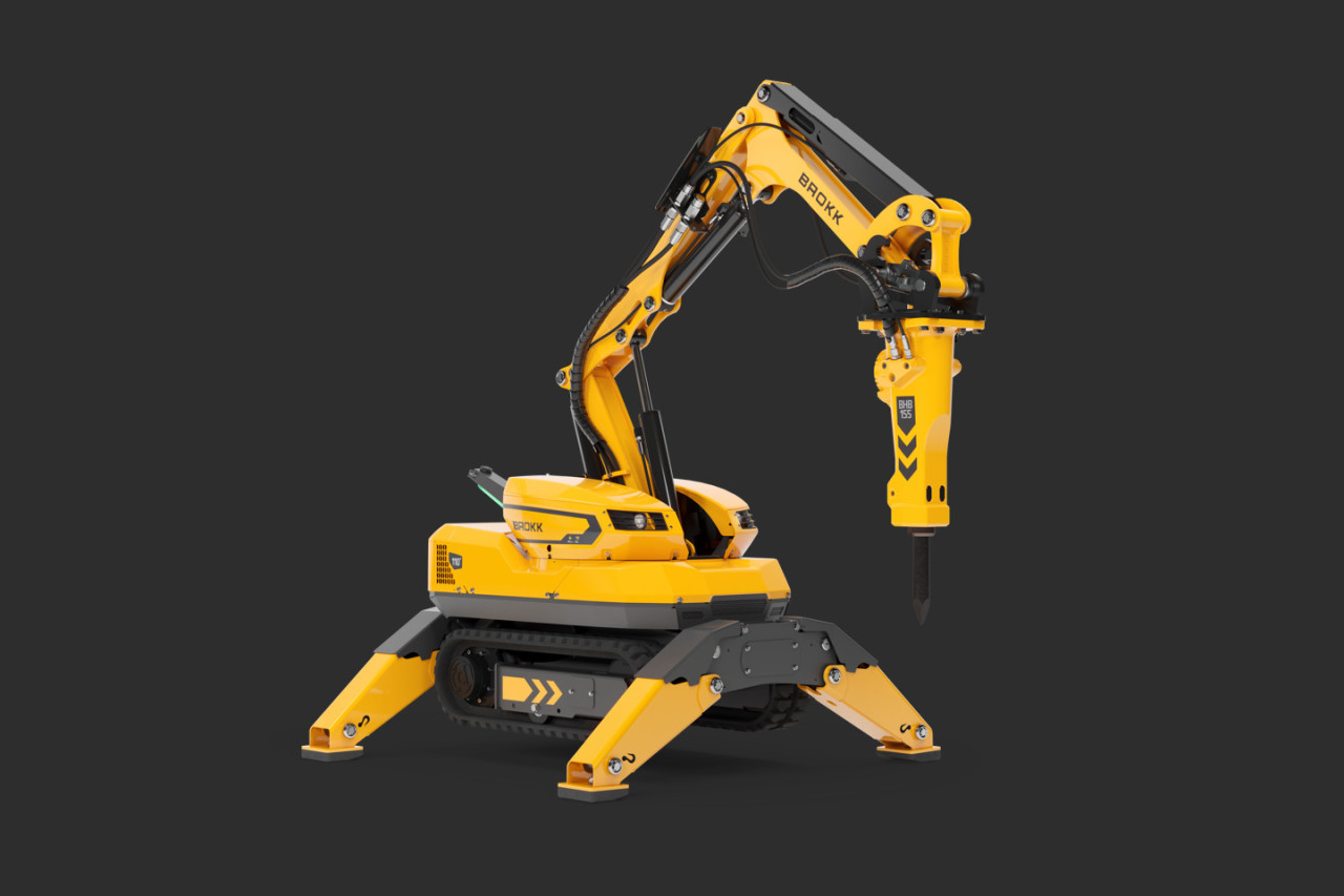 Compact Brokk 110+ demolition robot shown with extended hydraulic breaker arm on a dark background.