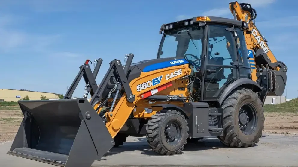 Left side view of a parked Case 580EV Electric backhoe loader.