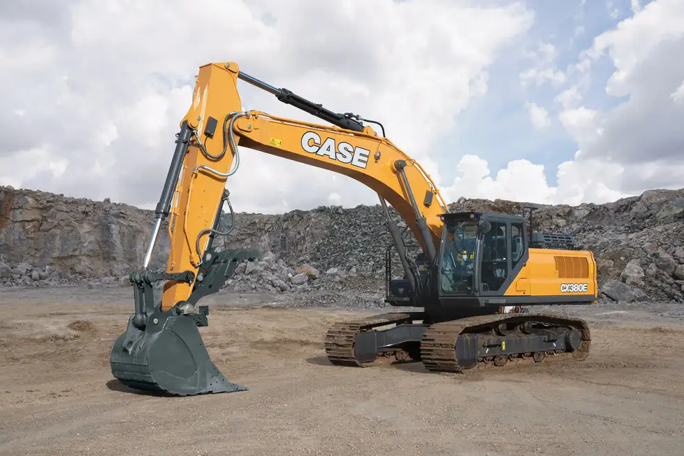 Left side view of a parked Case CX380E excavator surrounded by a rock wall.
