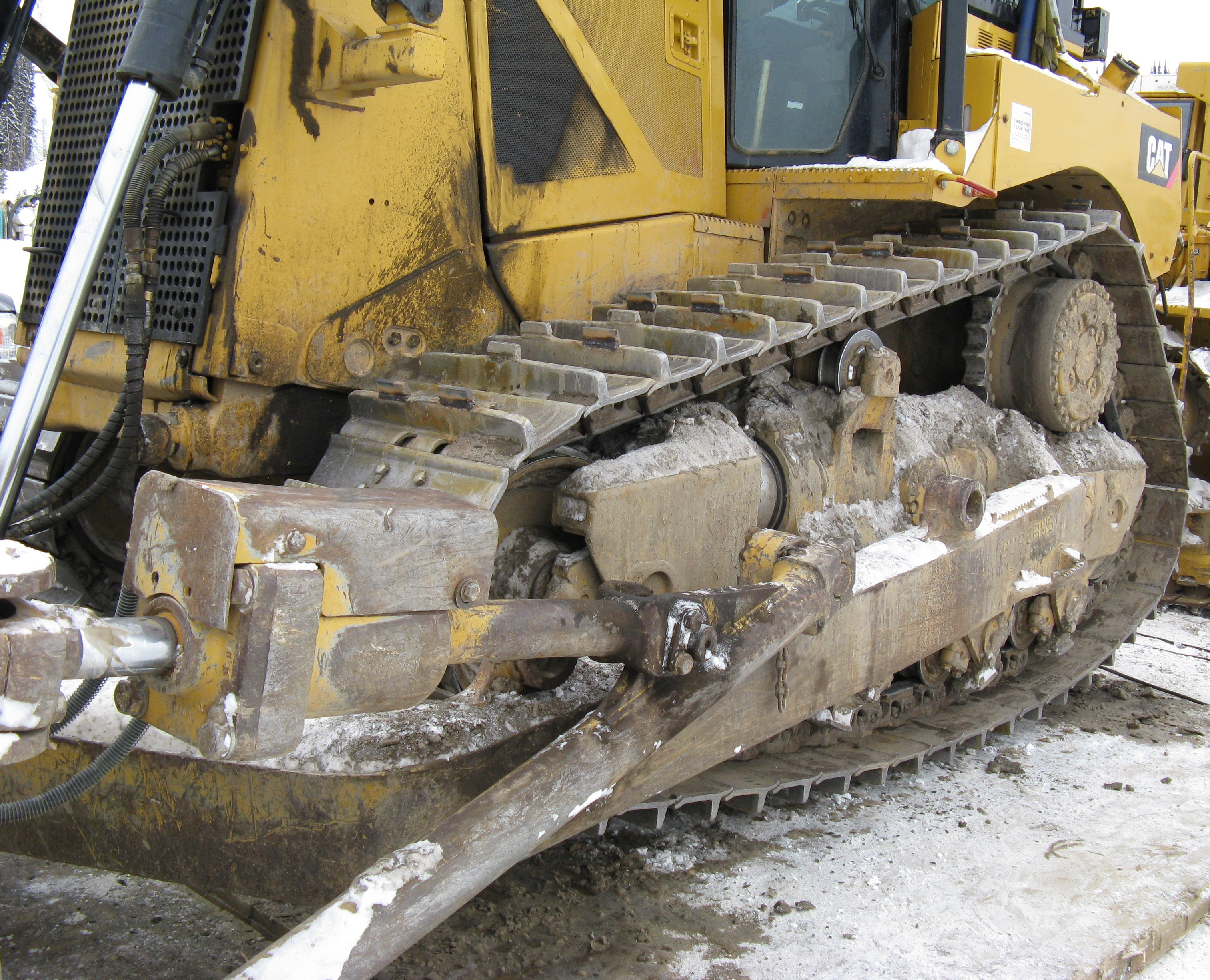 Left side dozer track closeup with ice lugs installed.