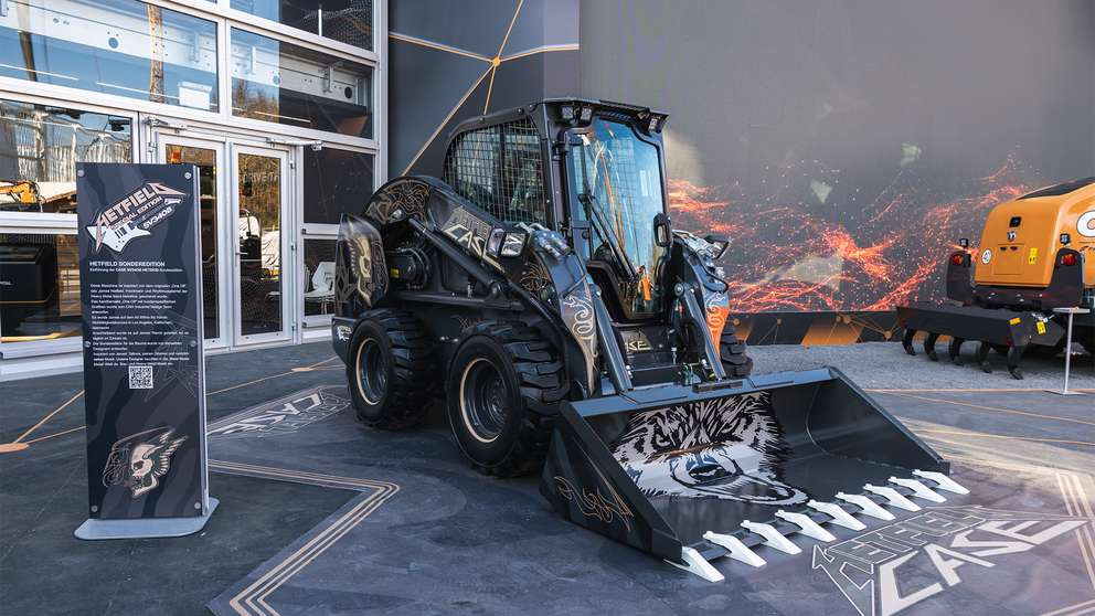 Black Case SV340B skid steer inspired by Metallica's James Hetfield and includes a skull with wings and other artwork.
