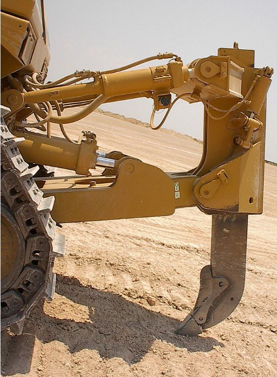 Close up view of a single tooth ripper attachment for a dozer.
